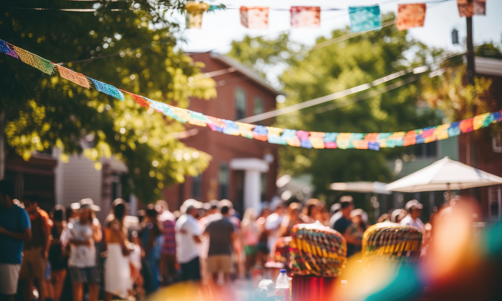 A blurred photo of a neighborhood block party celebrating a cultural event