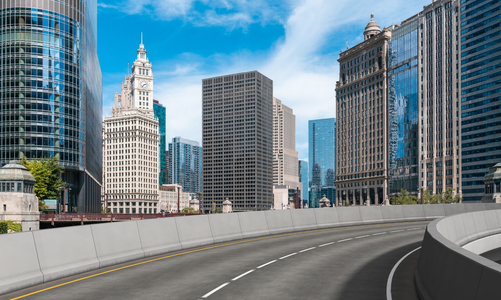 Driver-view image riding along a ChIcago highway with skyscrapers in the background