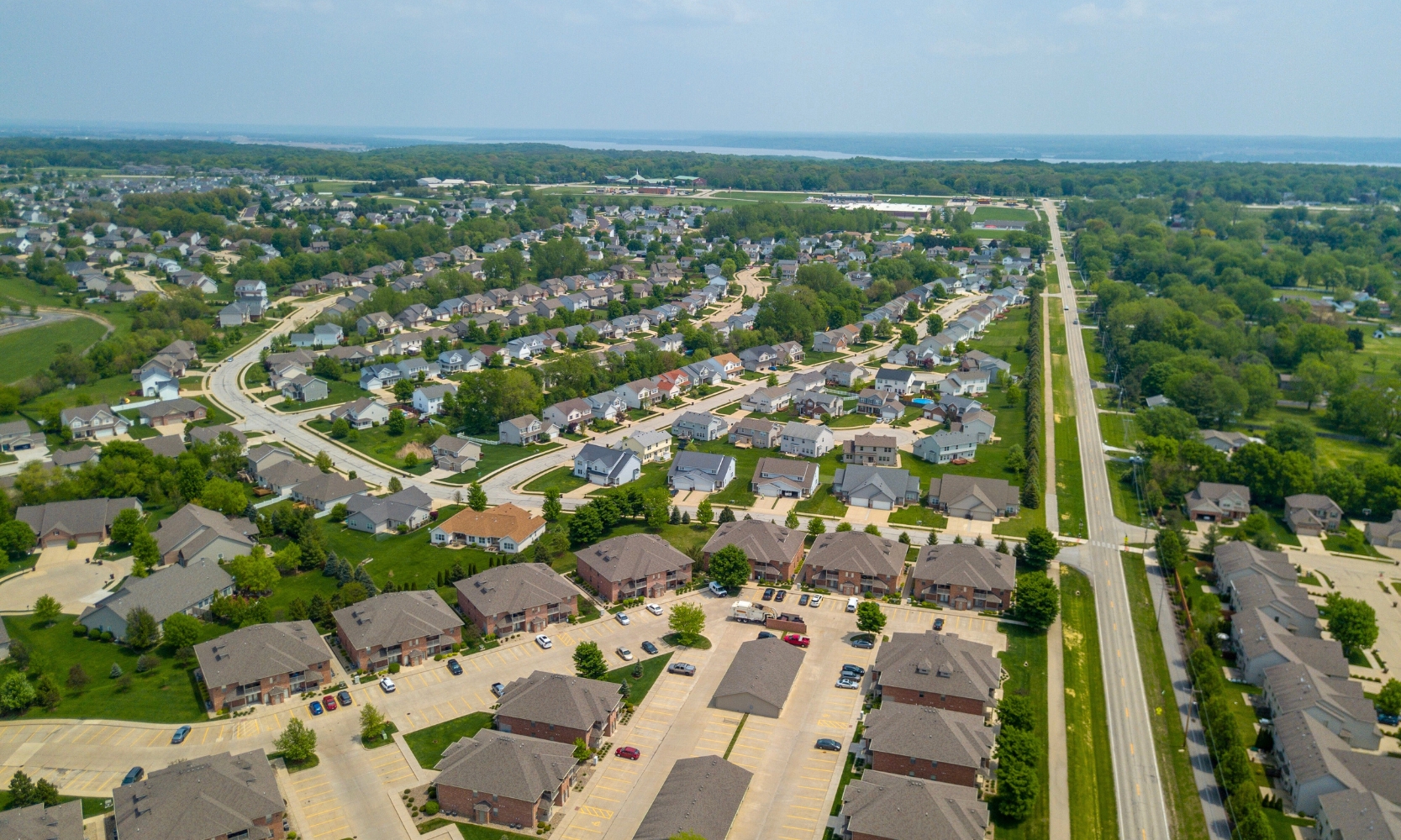 Aerial view image of an outer Chicago suburb with Lake Michigan in the backgorund