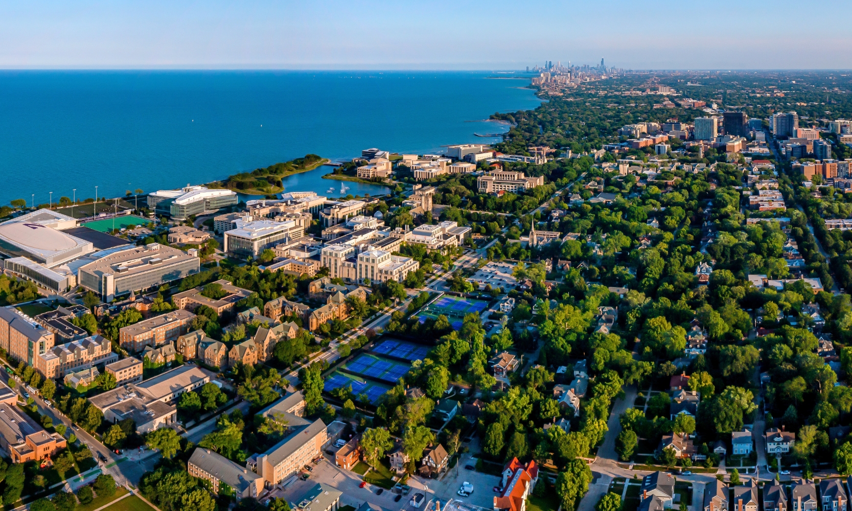An aerial view image of Evanston, IL with the Chicago skyline in the background