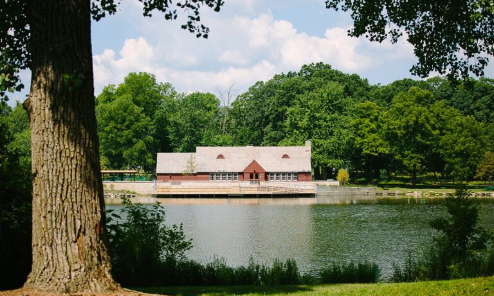 Zoomed out image of the Lake Ellyn Park boathouse in Glen Ellyn, IL