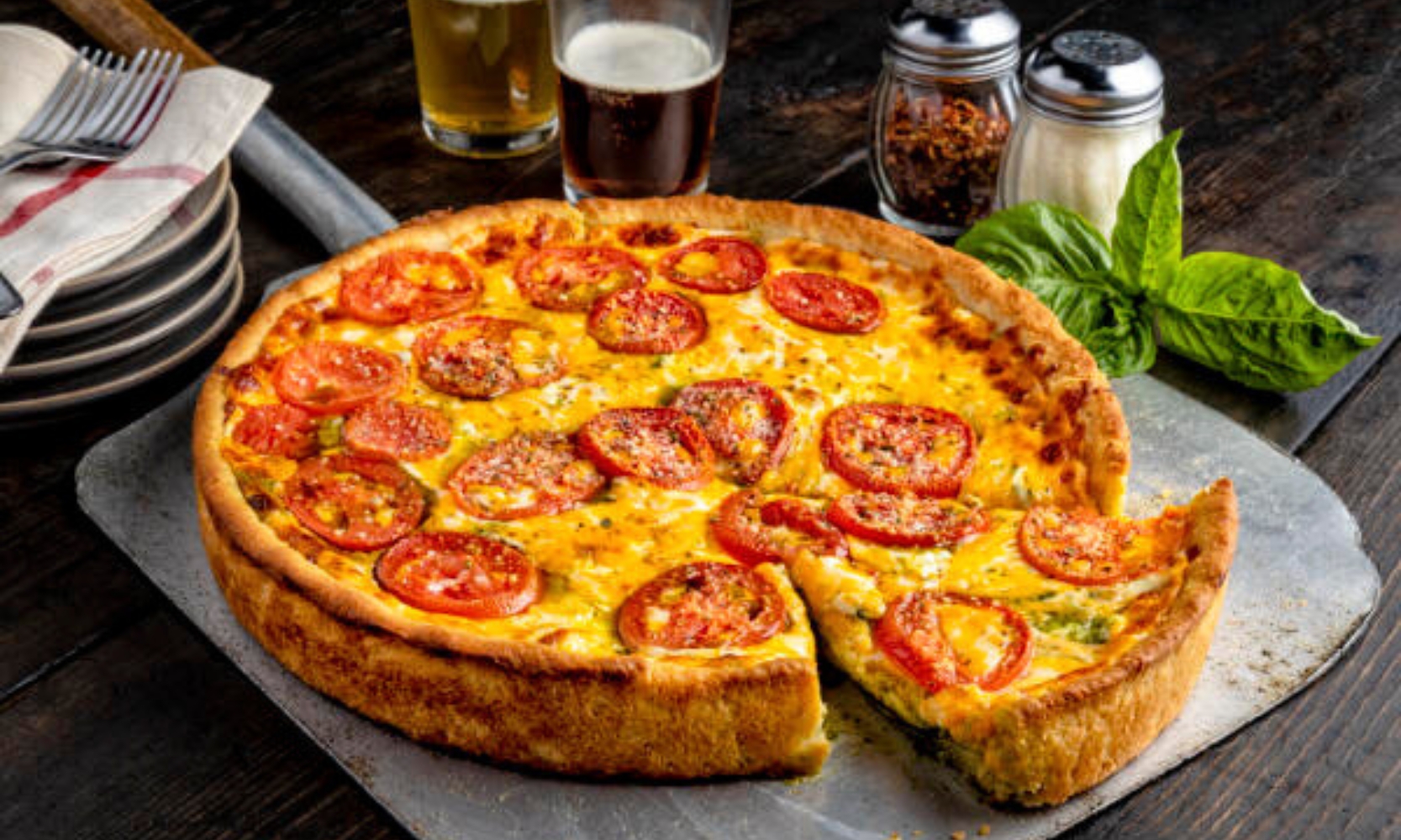 Closeup image of the four cheese and pesto deep dish pizza at Pizzeria Uno in River North, Chicago