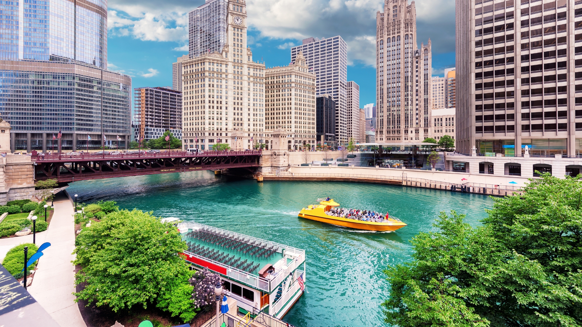 An image of River North, Chicago, with a ferry boat tour and building landscape