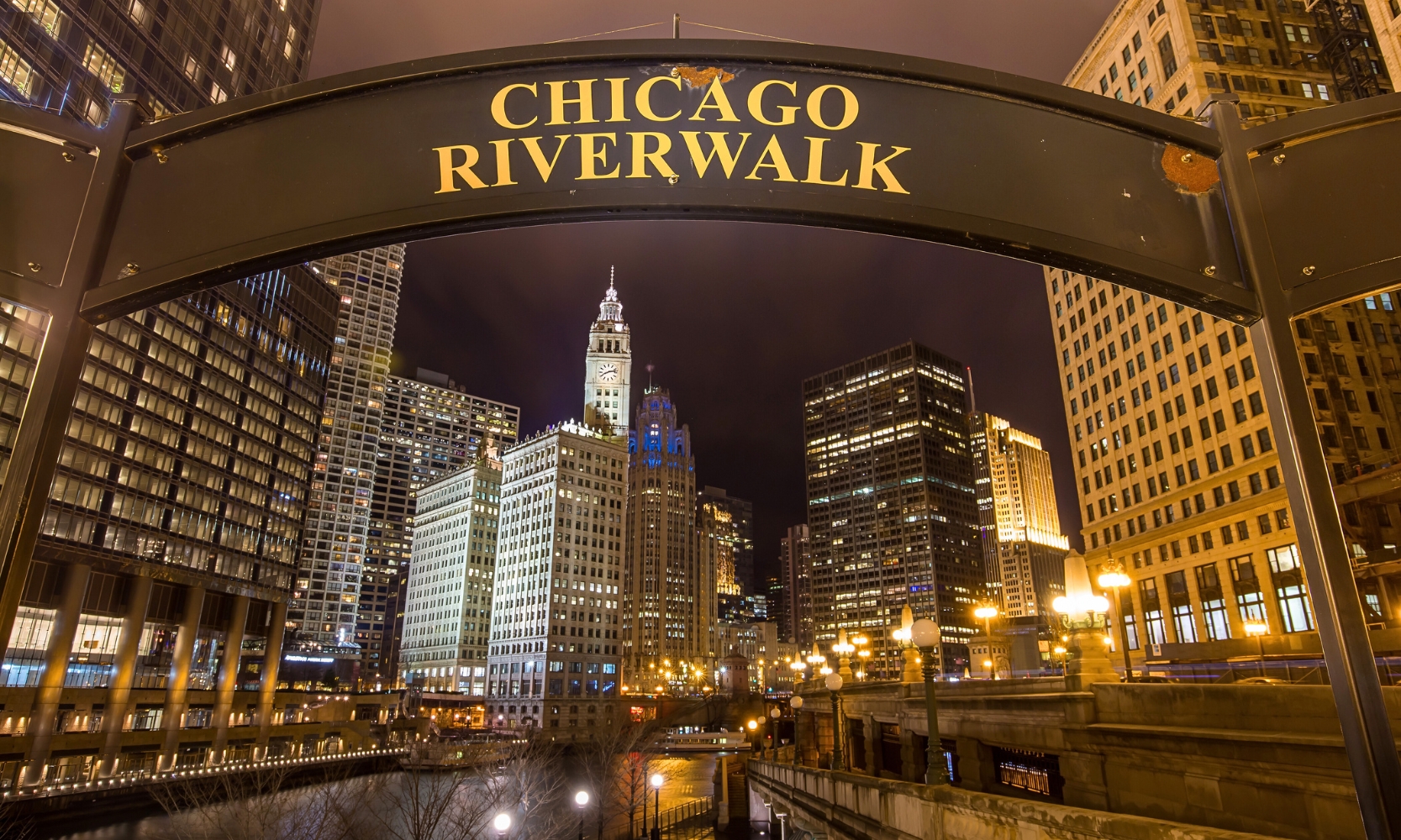 An image of the Chicago Riverwalk and building landscape at night