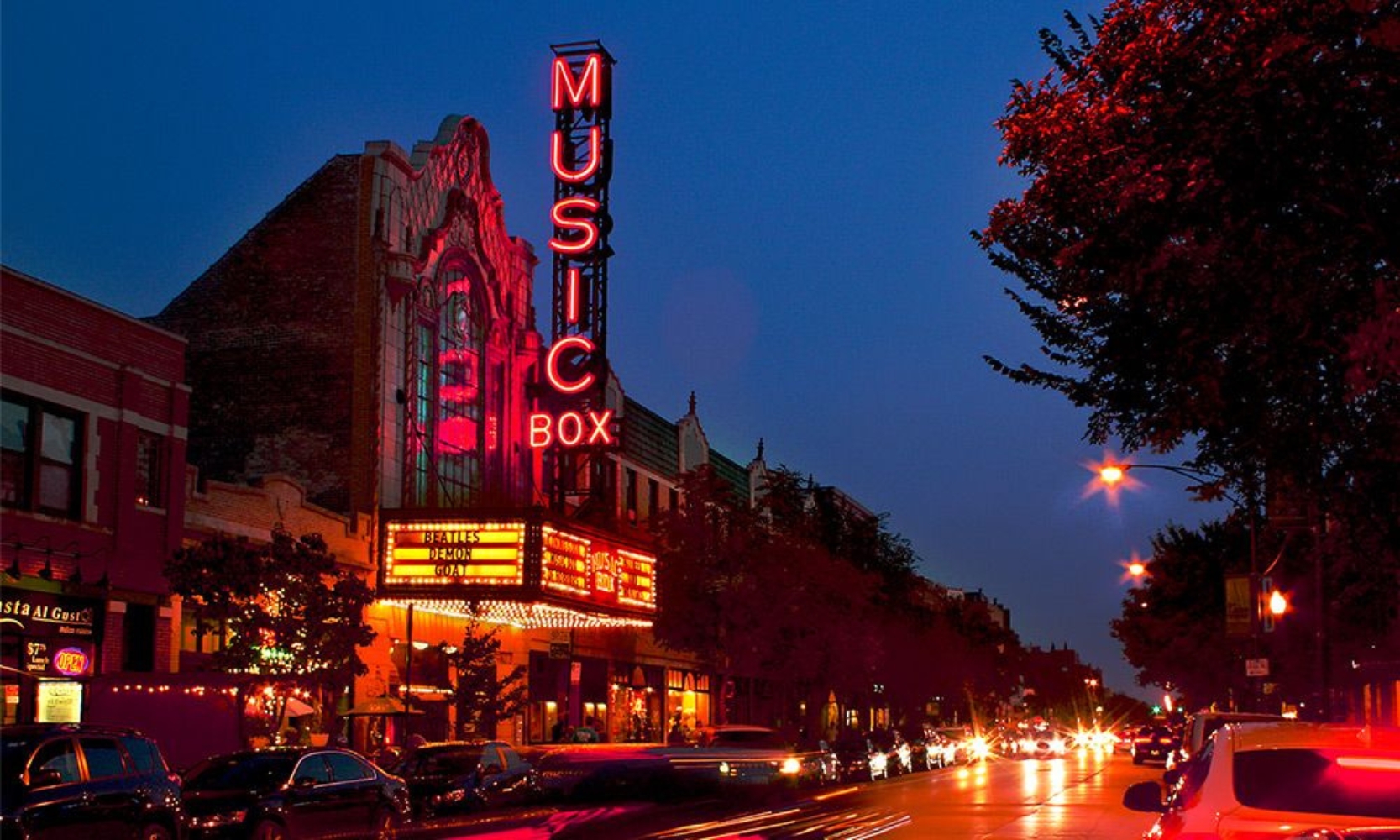 Image of the Belmont Theater District at night in Lakeview, Chicago