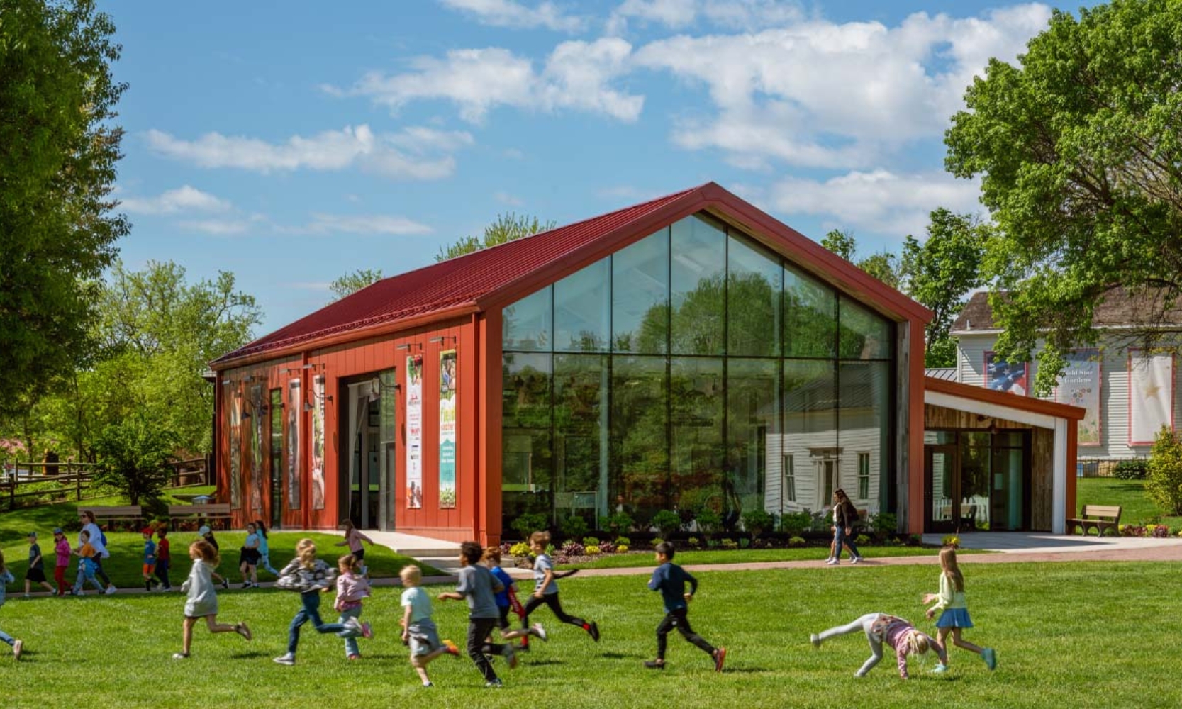 An image of children playing outside the Naper Settlement building in Naperville, IL