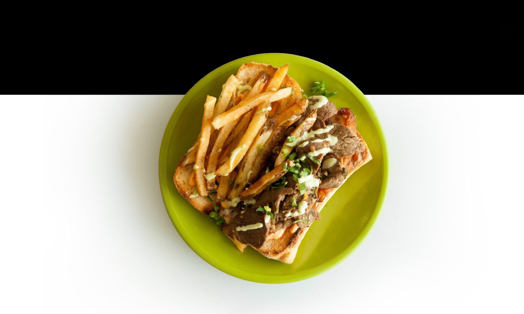 Top view image of a sirloin steak sandwich at SanguCHE in Naperville, IL