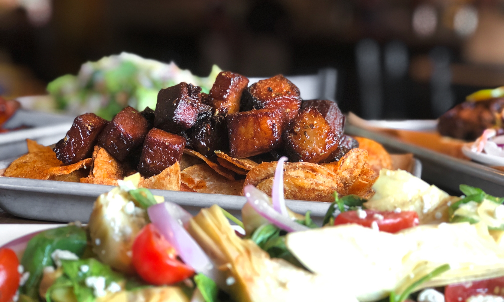 Closeup image of a meet and vegetable dish at Nobel House in Geneva, IL