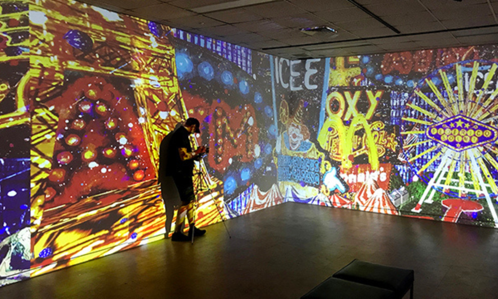 A person taking photos of a light display exhibit at the Block Museum of Art at Northwestern University Evanston