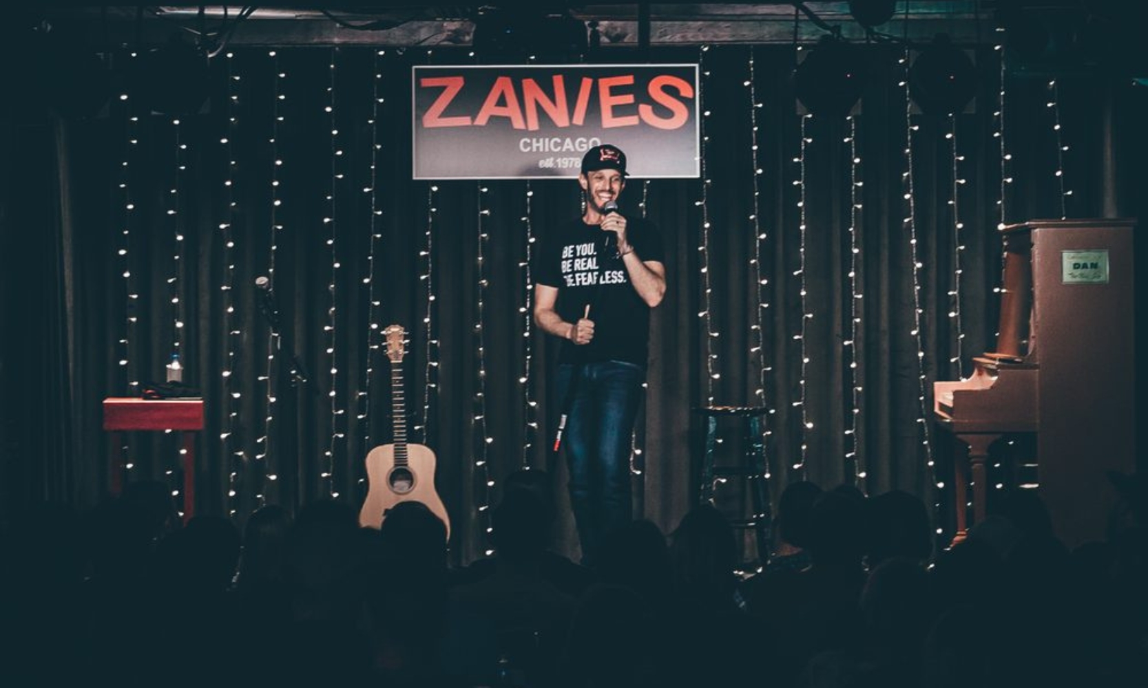 Image of a person doing a stand up comedy show at Zanies in Chicago