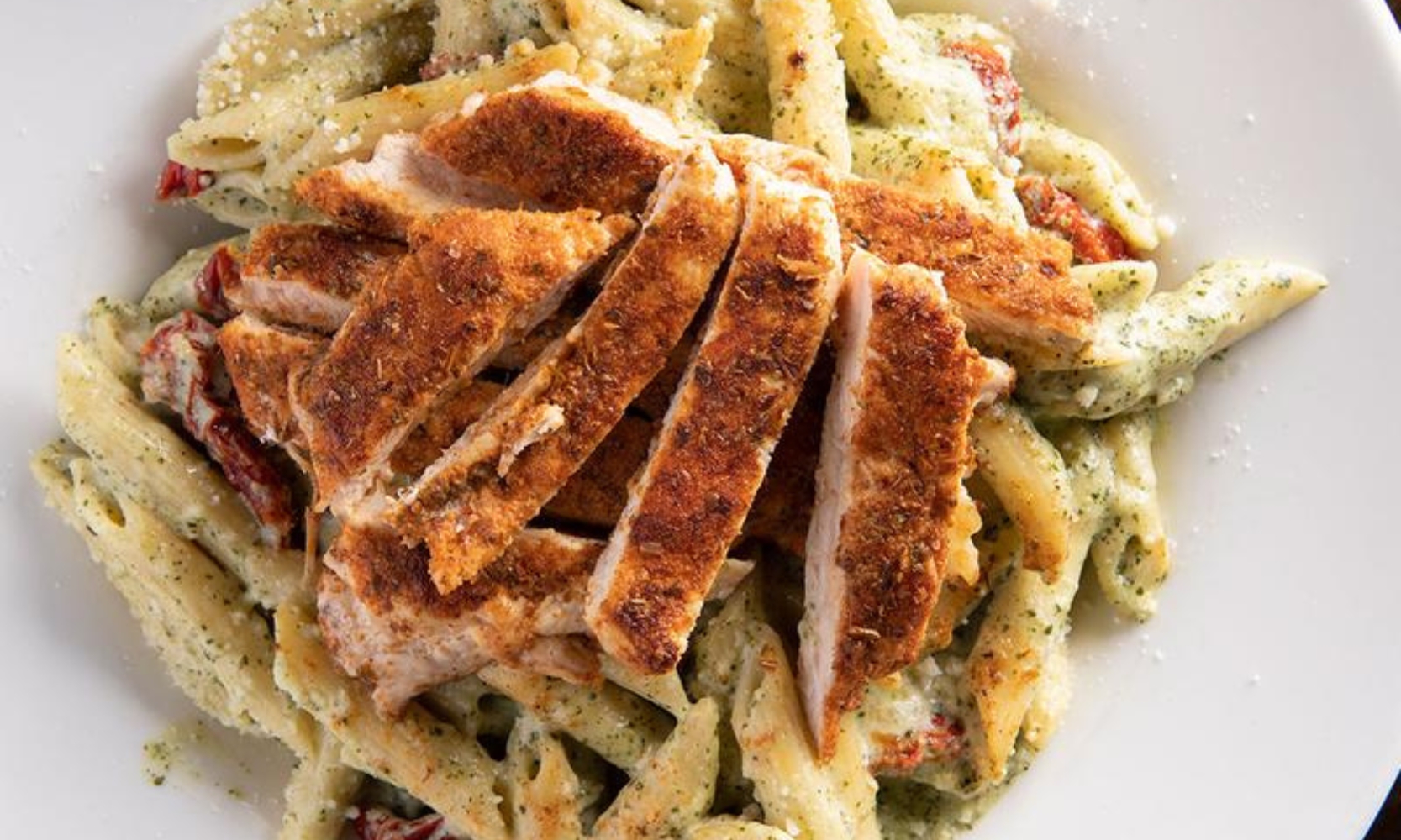 Closeup image of a whiskey salmon pasta entree at Peggy Kinnane’s Irish Restaurant & Pub in Arlington Heights, IL