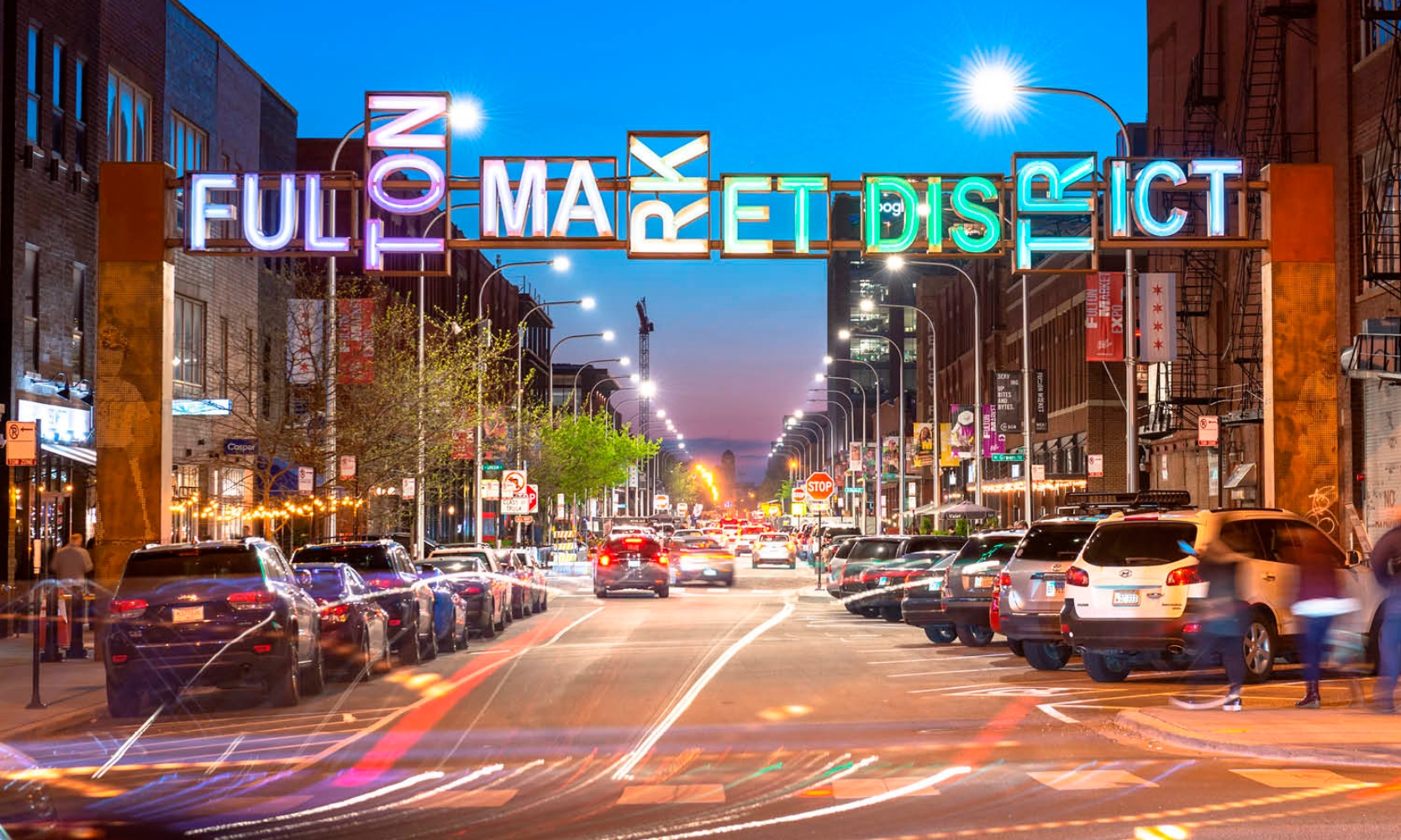 Street view image of Fulton Market District at night