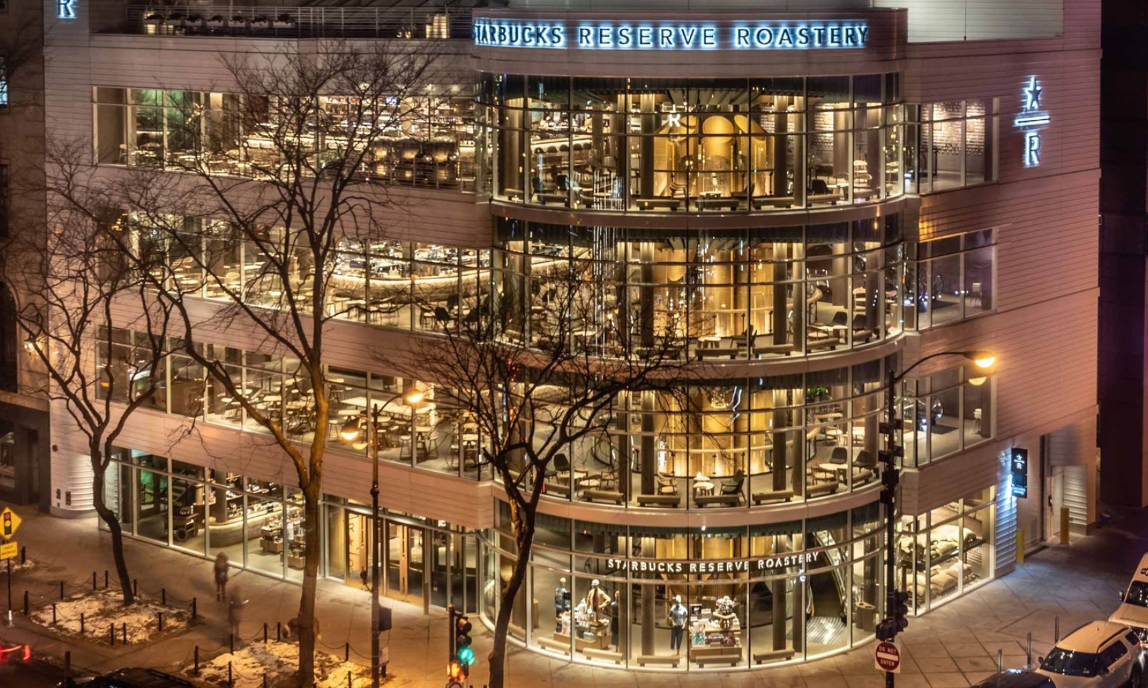 Nighttime exterior image of the Starbucks Reserve Roastery in Streeterville, Chicago