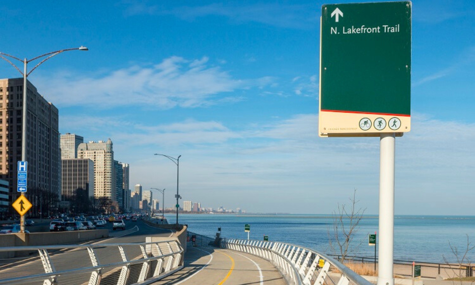 Closeup image of the Lakefront Trail with skyscraper and Lake Michigan views during the day in Chicago