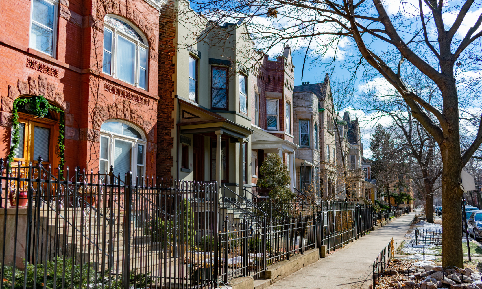 Image of row homes on a tree-lined street in the Wicker Park, Chicago, neighborhood during winter